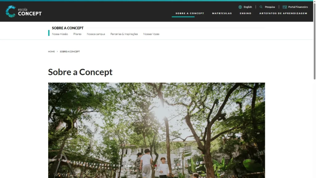 The Sobre a Concept (About Concept) page on the Escola Concept website, with the site menu and a photo of the school's tree-lined courtyard